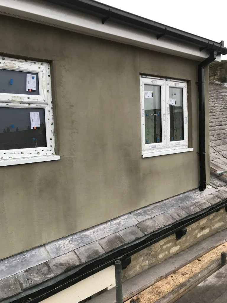 Dormer render basecoat application stage UK