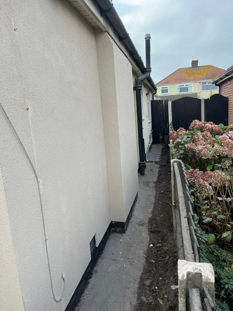 Rear and side of a house with a newly finished render