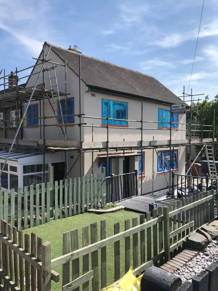 Two storey house rendering window protection work