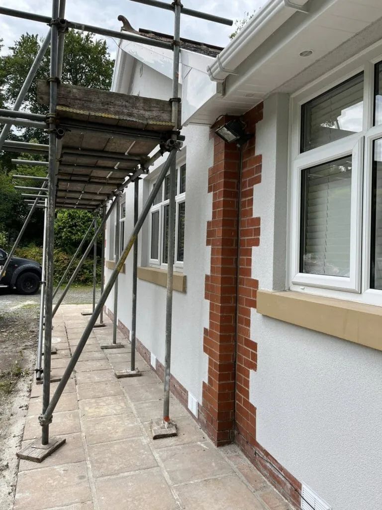 White render bungalow side elevation scaffold